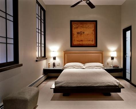 a bedroom with a large bed and two lamps