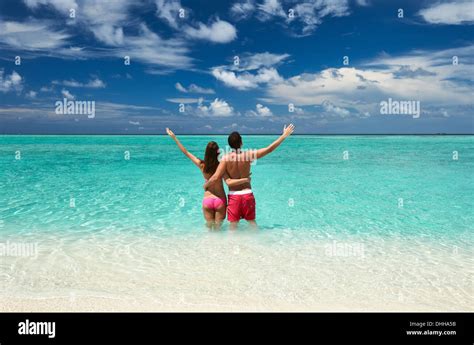 Couple on a beach at Maldives Stock Photo - Alamy