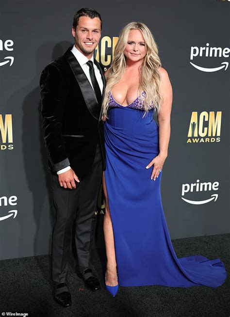 Miranda Lambert flaunts her cleavage in a busty blue gown alongside her ...