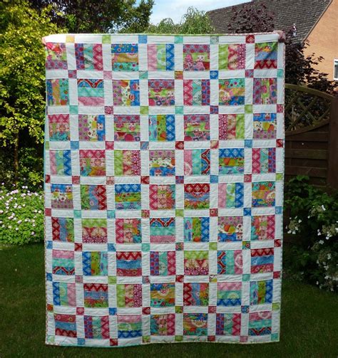 30 Jelly Roll Quilt Patterns and Designs - The Funky Stitch