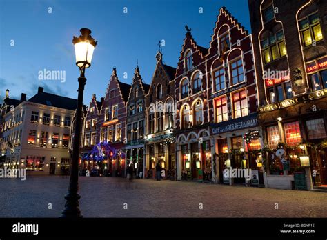 Restaurants in the Bruges Market Square at Christmas Stock Photo - Alamy