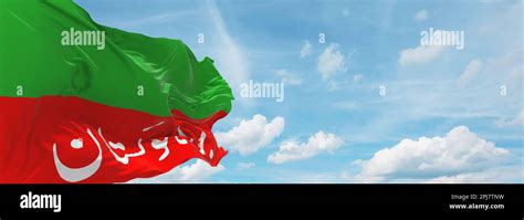 flag of Dravidian peoples Brahui people at cloudy sky background, panoramic view. flag ...