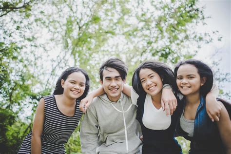 Happy teenage friends smiling outdoors at a park 1926162 Stock Photo at ...