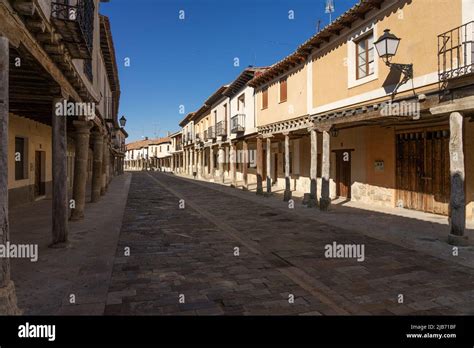 Streets with a traditional Castilian architecture with its houses with arcades in Ampudia ...