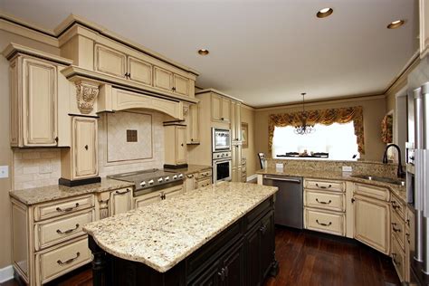 Antique White Kitchen Cabinets With Dark Granite Countertops – Two Birds Home