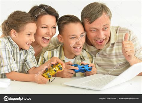 Family playing computer games — Stock Photo © aletia #194611898