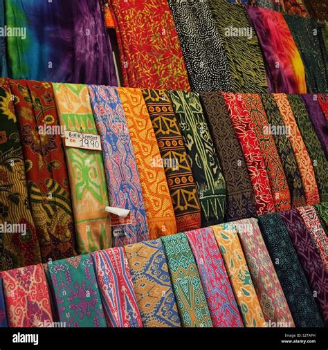 Traditional-design batik sarongs for sale in a souvenir shop in the old ...