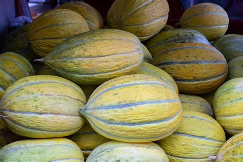 Premium Photo | Many melons in the farmers market ripe melon