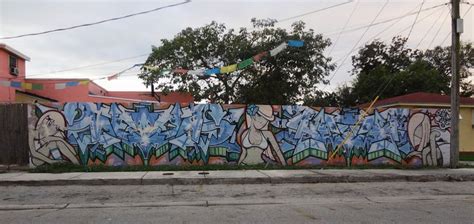 Codes: graffiti, script based, characters. Graffiti outside a private home in Little Haiti ...