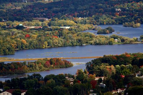 an aerial view of a lake surrounded by trees