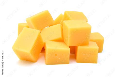 Cubes of cheddar cheese isolated on white Stock Photo | Adobe Stock