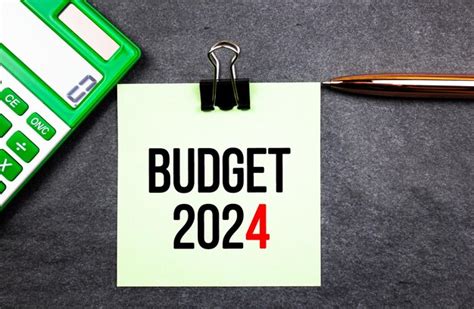 Premium Photo | Budget 2024 text with calculator on the table financial concept budget 2024 ...