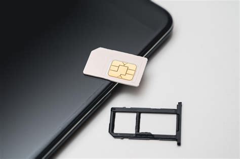 Premium Photo | SIM card replacement in the phone Mobile Simcard