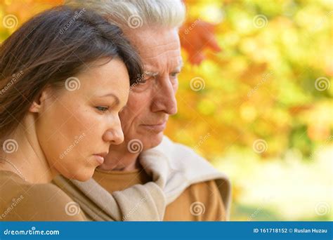 Close Up Portrait of Sad Woman and Senior Man Hugging Stock Photo - Image of autumn, adult ...