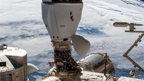 Space Station Crew Preparing for Spacewalks As SpaceX Cargo Dragon Launch Nears
