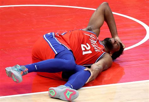 Joel Embiid exits with leg injury: 76ers 'praying' for his health