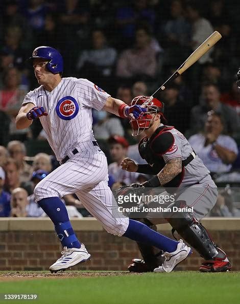 Patrick Wisdom of the Chicago Cubs hits a single in the 10th inning ...