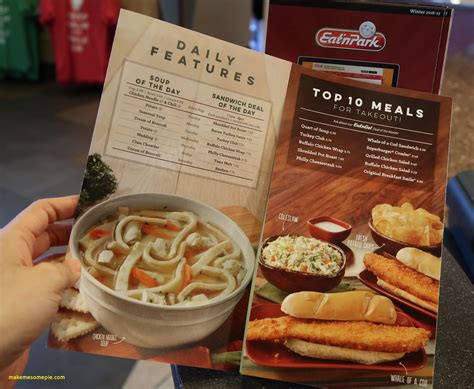 a person holding up a menu with food in front of them and an order on ...