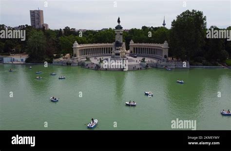 Retiro Park (El Retiro) - Tourists Rowing Boats In The Lake With Monument Stock Video Footage ...