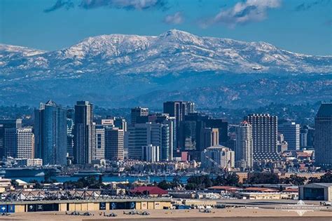 Snow in the mountains behind the San Diego Skyline | San diego skyline ...