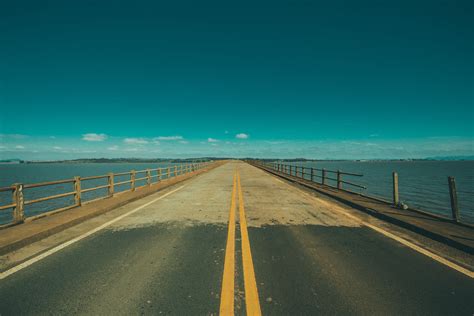 Grey Concrete Road in the Middle of the Sea · Free Stock Photo