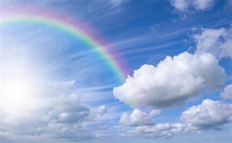 Rainbow over the blue sky