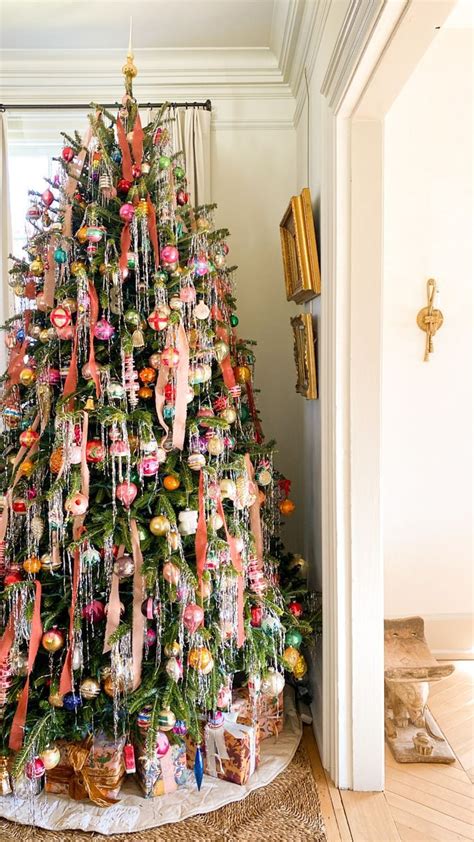 a christmas tree decorated with ornaments and ribbons