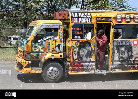 KENYA, Nairobi, Graffiti street art and traffic, colorful painted SACCO mini bus Matatu / KENIA ...