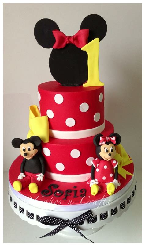 Minnie Mouse Tiered Cake With Edible Mickey And Minnie - CakeCentral.com