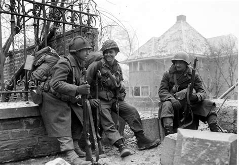 American Infantrymen pause to rest Battle of the Bulge, Picture Royalty ...