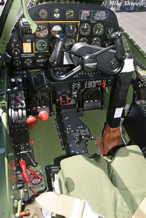 the cockpit of an airplane that is green and has many instruments on it ...