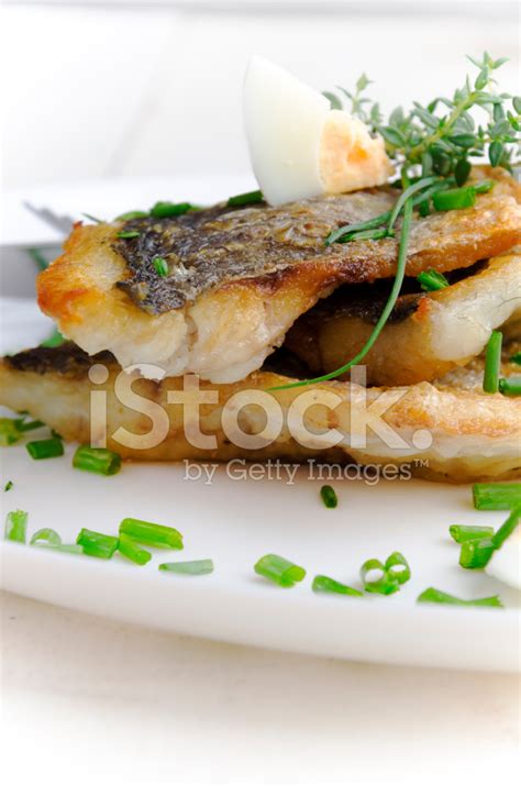 Fried Dorada Fillet With Egg, Chives And Thyme Stock Photo | Royalty ...