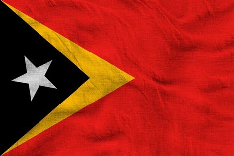 Premium Photo | National flag of East Timor Background with flag o of ...