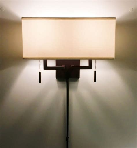 Mix the Soft Modern aesthetic of the Millennium 2-light wall sconce with any décor to update and ...