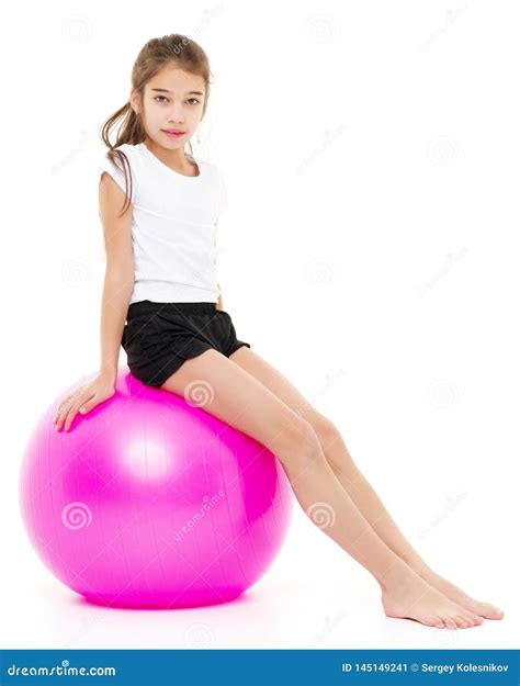 Little Girl Doing Exercises on a Big Ball for Fitness. Stock Image - Image of background ...