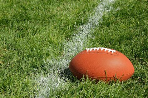 American Football on Natural Grass Field Stock Photo - Image of green ...