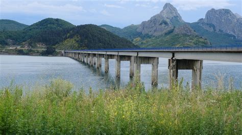 Premium Photo | Riaño bridge with the reservoir and mountains on a ...