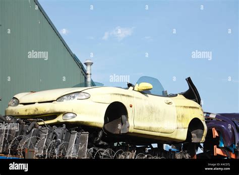 scrap metal car on scrap yard Stock Photo - Alamy