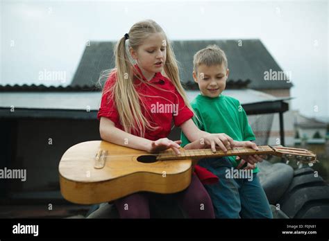 children learn to play the guitar Stock Photo, Royalty Free Image ...