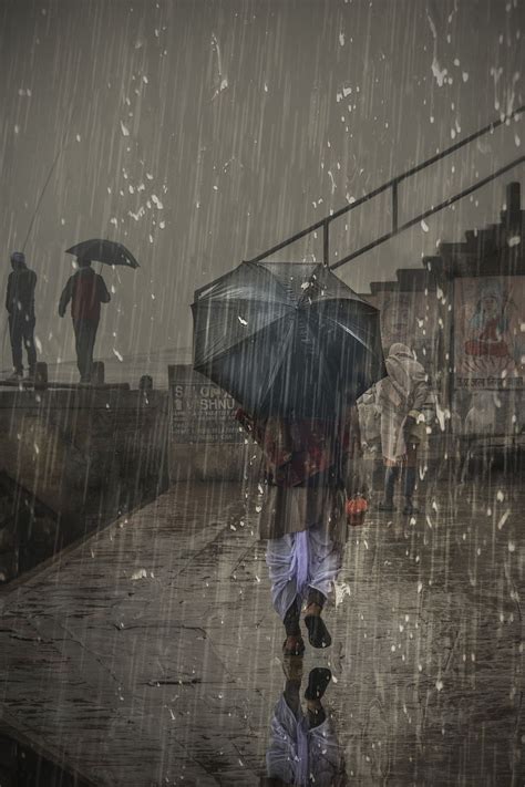 Street in Varanasi | Walking in the rain, Rain photography, Rain art