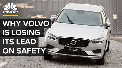 a volvo car parked in front of a building with the words why volvo is ...