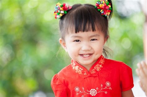 Premium Photo | Happy cute asian little child girl in chinese tradition ...