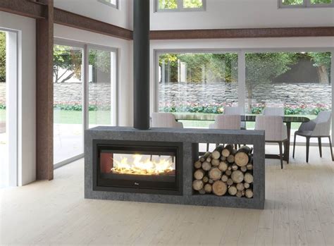 Make your fireplace part of two rooms with the Lacunza Double Sided Wood Fireplace. Efficient an ...