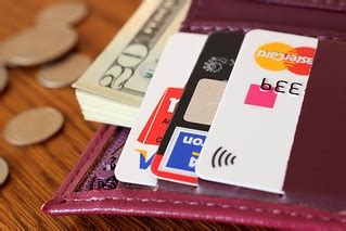 Women's wallet with money | Photo by CafeCredit under CC 2.0… | Flickr