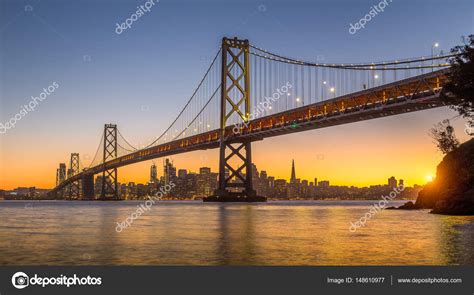 San Francisco skyline with Oakland Bay Bridge at sunset, California, USA Stock Photo by ...