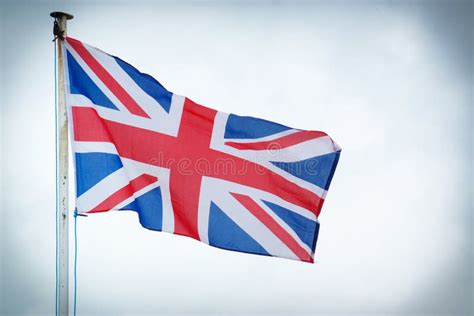 The Union Jack Flag of the United Kingdom Blows in the Wind Stock Image ...