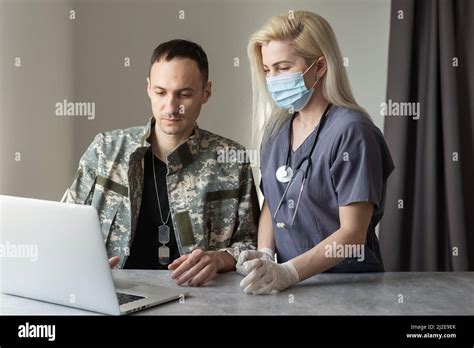 medical worker with military officer patient in hospital Stock Photo ...