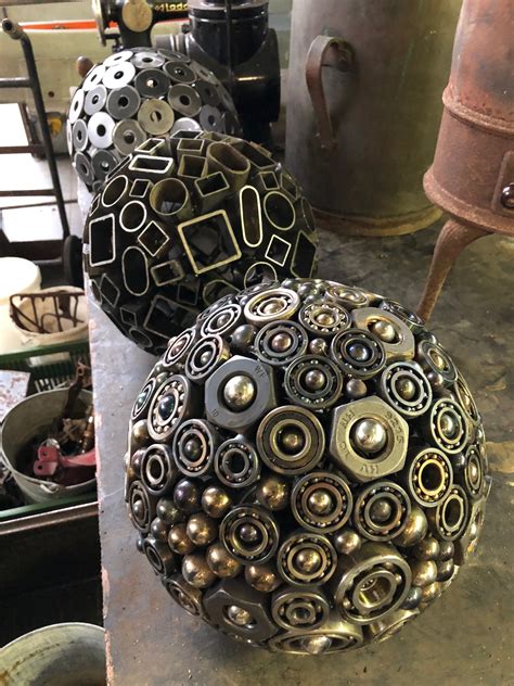 These metal spheres are amazing. I particularly like the one at the front that is made out of ...