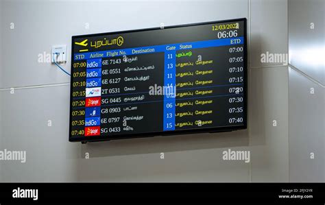 Departures information displayed in Tamil on television at the Chennai ...