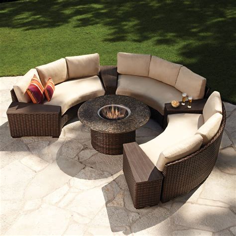 Modern outdoor wicker circular patio sectional with stone top fire table. Available in a ...